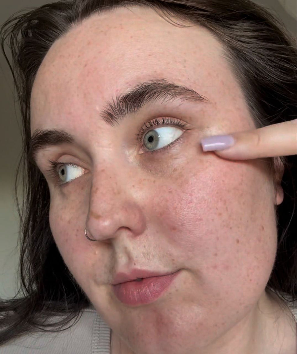 Close-up of a person  eye with finger.